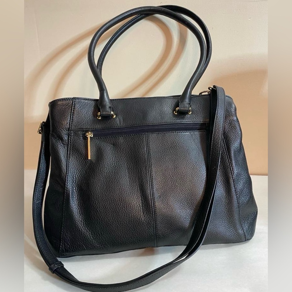 Danier Black Leather purse with handles and a tassel and long strap.